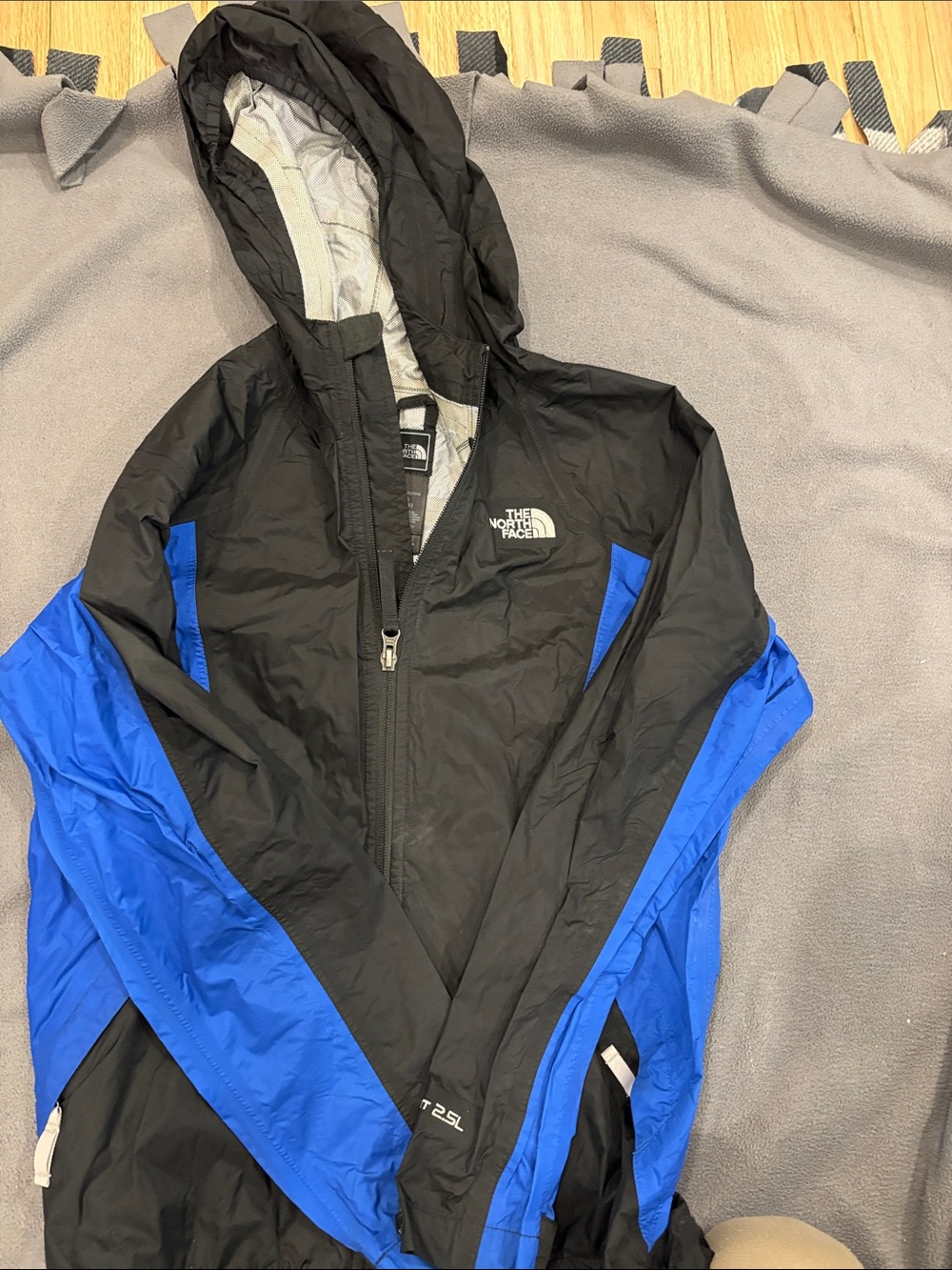 The North Face Black and Blue Kids' Hooded Rain Jacket